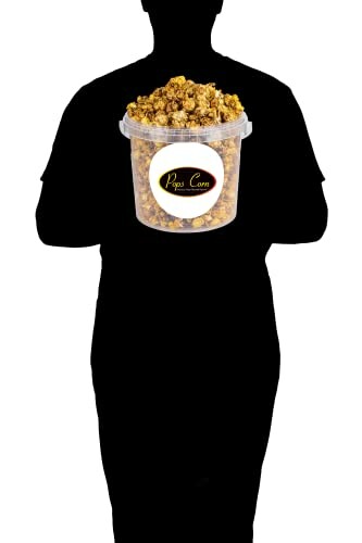 Silhouette holding a bucket of caramel popcorn